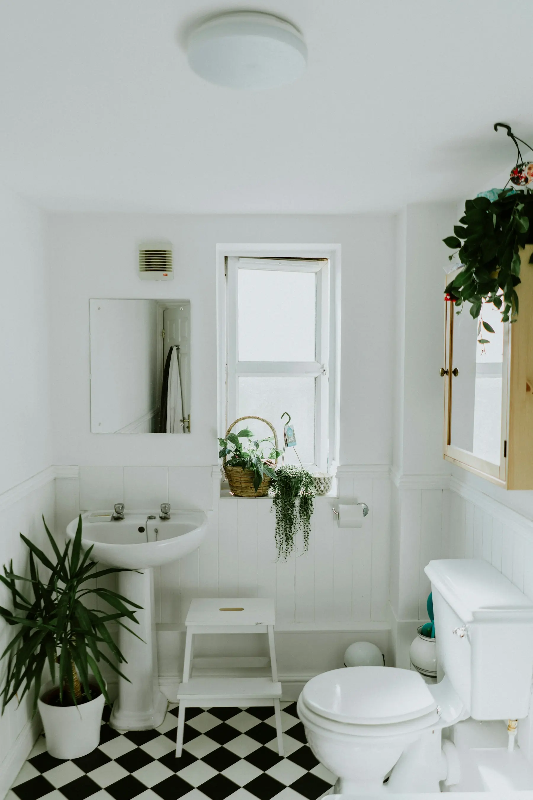 Bright modern bathroom with freestanding tub and natural materials