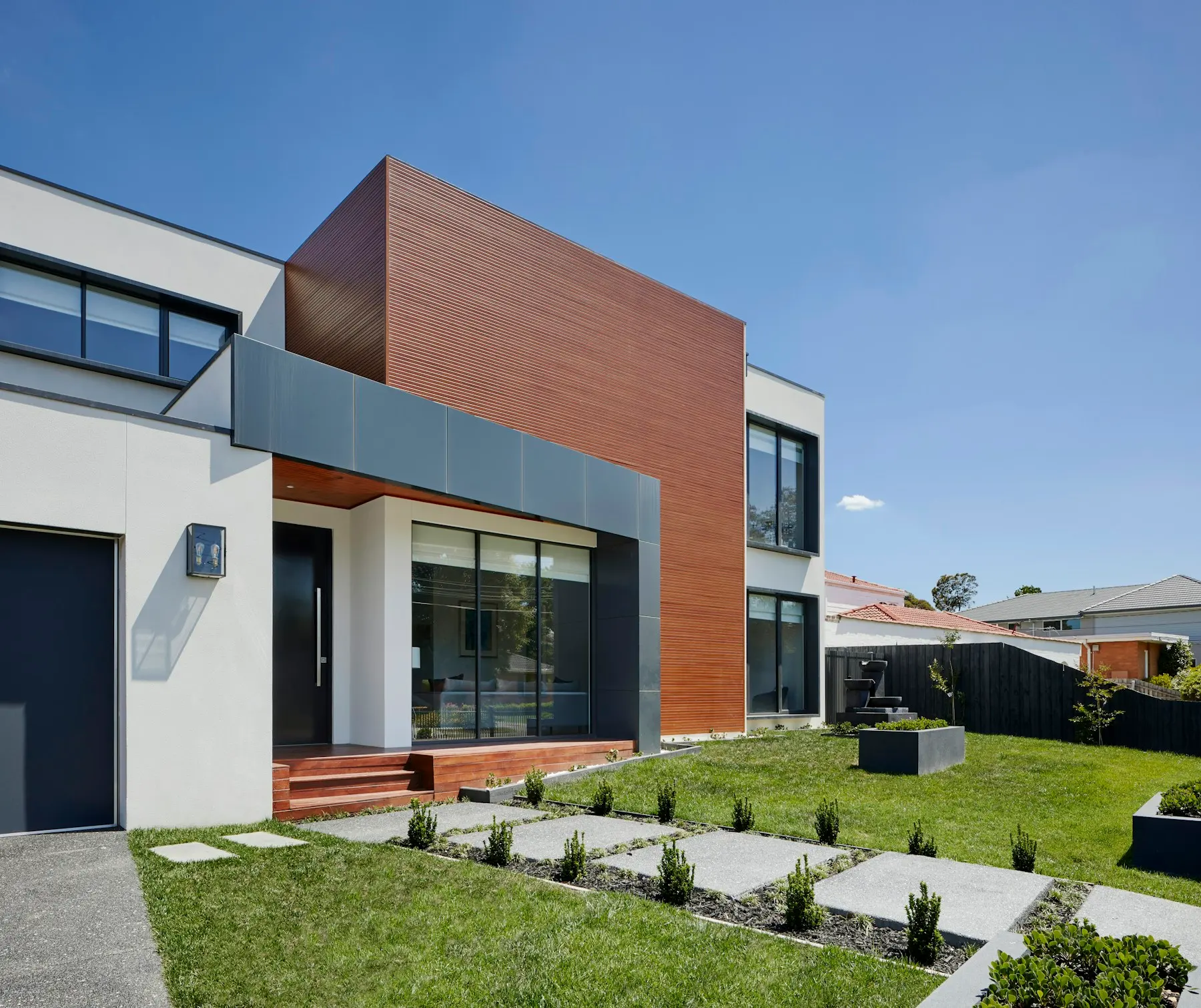 Contemporary home exterior and outdoor living area in warm light